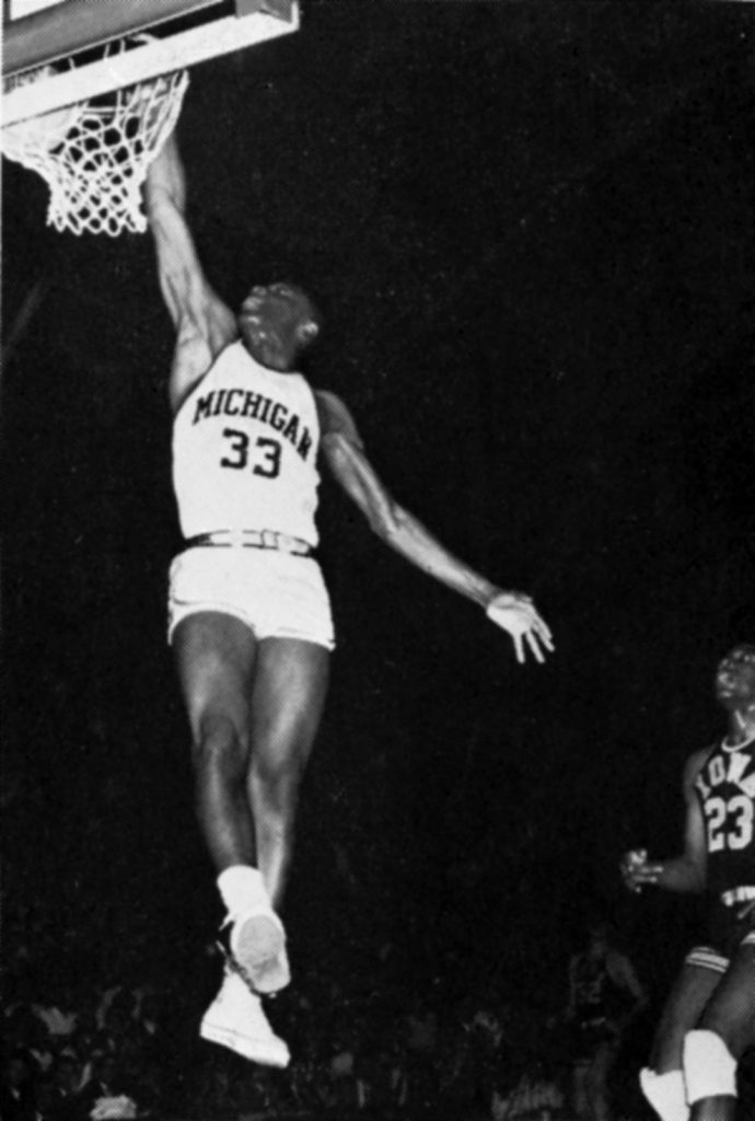 Cazzie Russell dunking a basketball in 1964