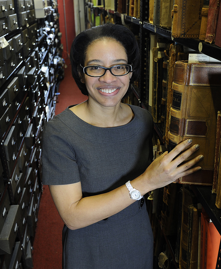 Angela Dillard among archival shelves at the Bentley Historical Library