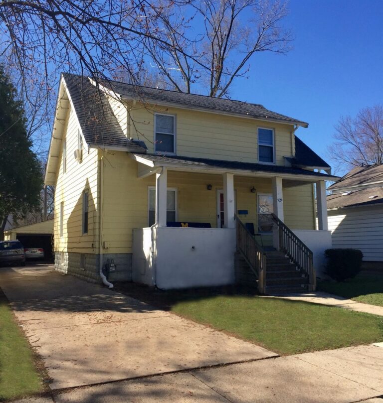 yellow house with white porch, 922 Woodlawn Avenue